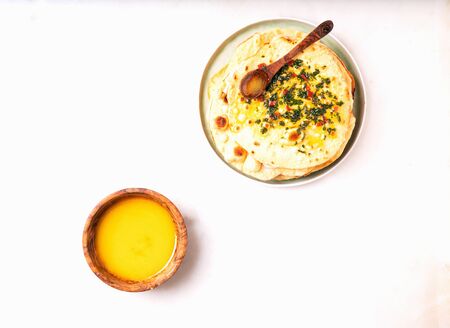 Traditional Indian flat bread Chapati served with Chimichurri sauce and clarified butter Ghee. Top...
