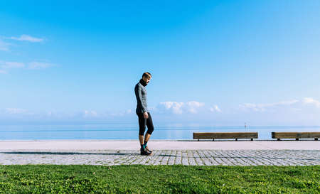 Middle aged man running, working out, doing excercise in the waterfront. Healthcare concept. Sport...