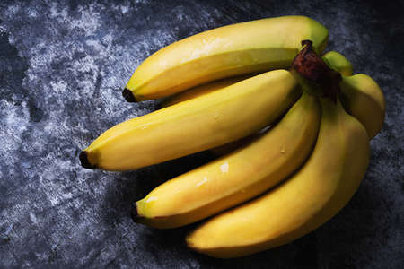 Bunch of Bananas on rustic metal background. Flat lay. Top View