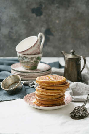 American breakfast , brunch, lunch, meal pancakes  with peanut butter and bananas over a white...