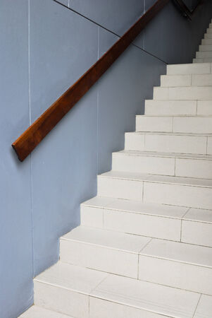 Blank stairways with wood railing Stairway to the darkの写真素材