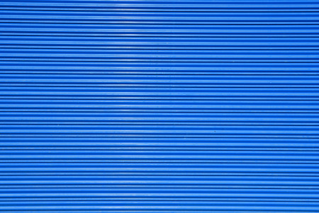 a shuttered roll up metal blue door
