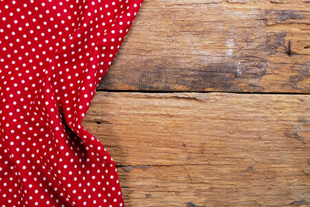 the background made from checkered napkin on old wooden tableの写真素材