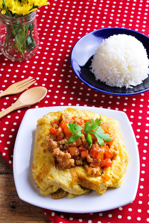 Rice ,stuffed omelette and tom kha kai ,chicken with coconut milk soup.の写真素材