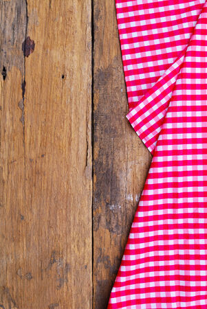 The background made from tablecloth on old wooden tableの写真素材
