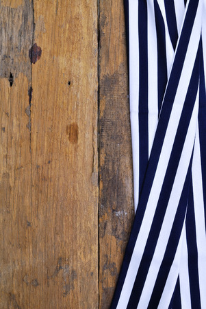 The background made from tablecloth on old wooden tableの写真素材