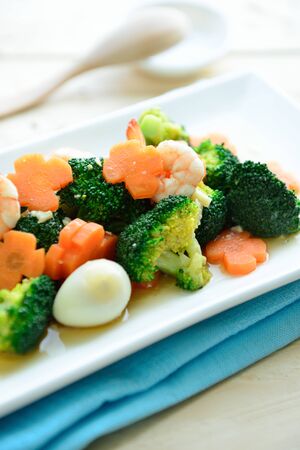 Stir-fried broccoli mixed vegetables , prawn and Quail egg in dishの写真素材