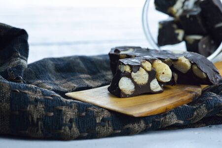 chocolate with nuts homemade on white tableの写真素材