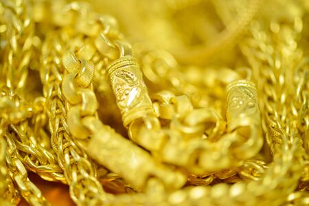 Gold necklaces , bracelets ,Blured and bokeh for gold backgroundの写真素材