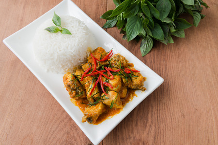 Fried chilli paste sauce with fish with herb and  steamed rice  thai foodの写真素材