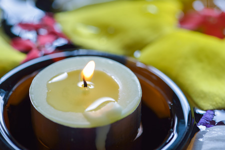 Candles  and beautiful flowers in the water spaの写真素材