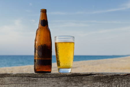 Glass of beer on a sunset