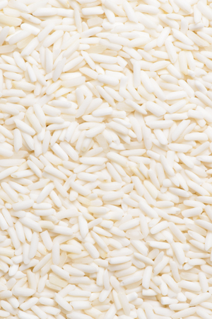 White sticky rice as a food background, Uncooked raw cereals, Macro closeup backgroundの写真素材