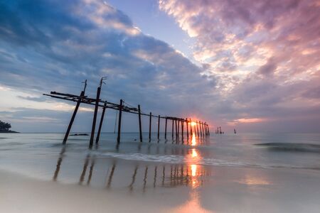sunset and sea, Old bridge at Pilai beach in sunset time. Takua Thung District , Phang nga , Thailand. Long exposureの写真素材