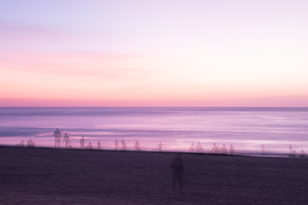 Blur people relax on tropical sunset beach abstract background.の写真素材