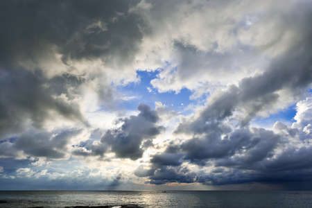 the dramatic sky with clouds and sunの写真素材