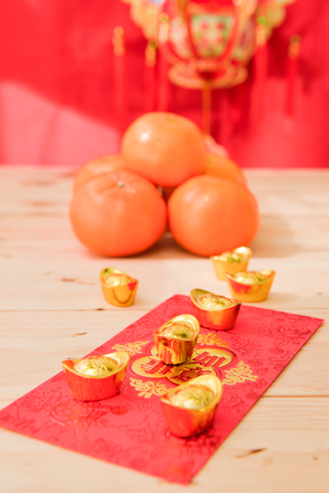 mandarin oranges with Chinese new year red packets  (Foreign text means All achievements )の写真素材