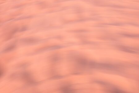 Blurred sand sunset on beach use as abstract background.の写真素材