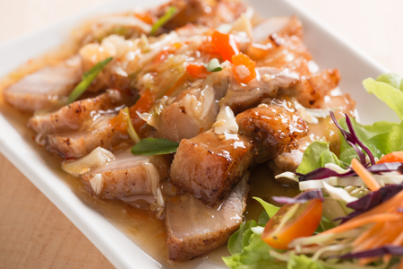 Deep fried pork Chinese Style belly with spicy sauceの写真素材