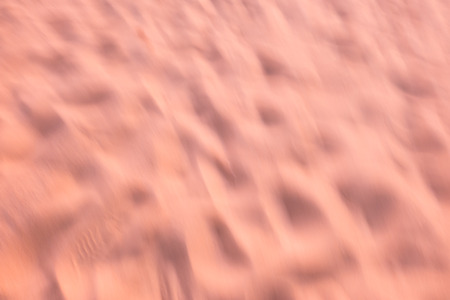 Blurred sand sunset on beach use as abstract background.の写真素材