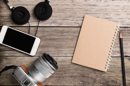Organized modern and retro objects on wooden table.の写真素材