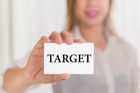 Target message word on card in hand of Friendly woman hand and smilingの写真素材