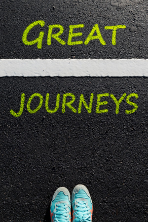 Inspiration quote : " Great Journeys " on aerial view of running shoe  on road with move forward yellow arrow ,Motivational typographic.の写真素材