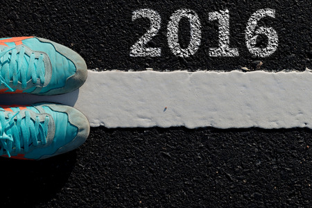 Year 2016 Shoes dirty sneakers blue on new white line asphalt roadの写真素材