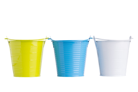 Colorful metal pots isolated on white backgroundの写真素材