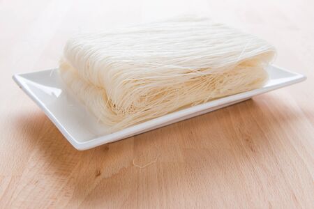 Close-up of white rice noodles on a white plate. rice vermicelli.の写真素材
