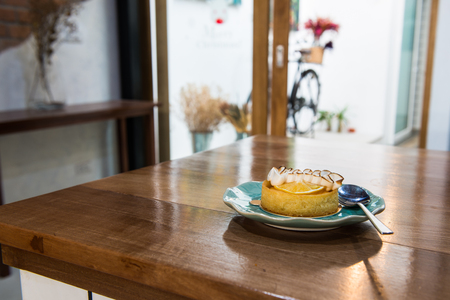 Lemon tart in blue turquoise plateの写真素材