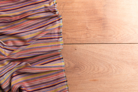 Abstract tablecloths on the wooden table backgroundの写真素材