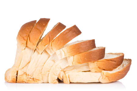 Fresh baked bread and sliced bread isolated on white backgroundの写真素材