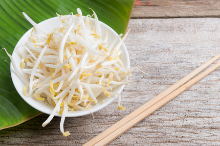 Bean sprouts on wooden backgroundの写真素材