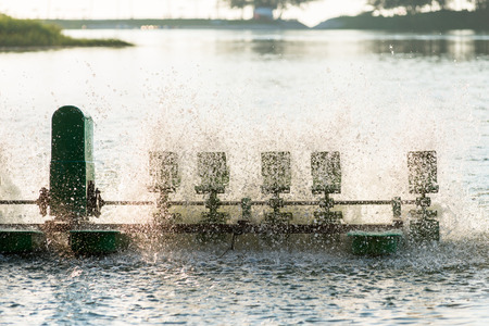 Water treatment equipment,Water turbines with plastic paddles on a rotating axle supplying water with fresh oxygen air.の写真素材