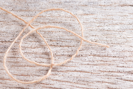 Hemp rope on wooden background