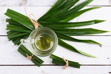 Fresh Fragrant Pandan Tea and leaves on white wood backgroundの写真素材