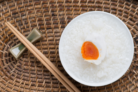 Rice gruel, boiled rice or rice congeeand with salted egg, chinese food styleの写真素材