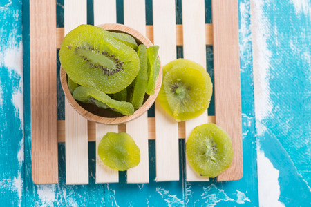 Dried Preserved Kiwi Fruit on rustic green backgroundの写真素材