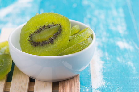 Dried Preserved Kiwi Fruit on rustic green backgroundの写真素材