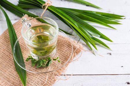Fresh Fragrant Pandan Tea and leaves on white wood backgroundの写真素材