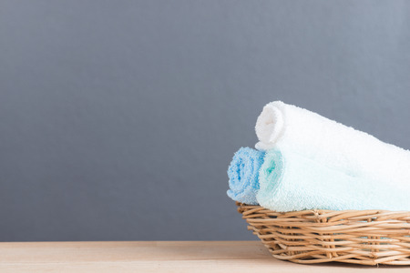 Blue and white towel on rustic wooden backgroundの写真素材