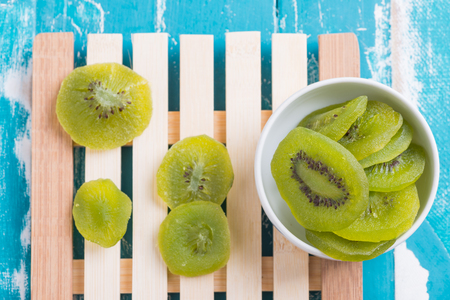 Dried Preserved Kiwi Fruit on rustic green backgroundの写真素材