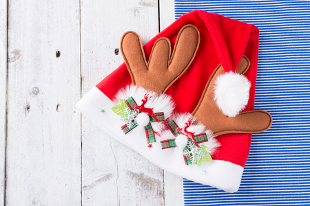 Santa red hat on wooden backgroundの写真素材