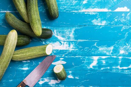 Fresh cucumbers on wood table. Green cucumber from Thailand.の写真素材