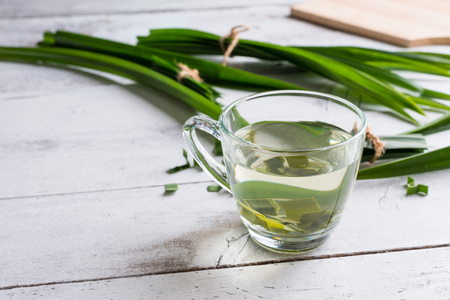Fresh Fragrant Pandan Tea and leaves on white wood backgroundの写真素材