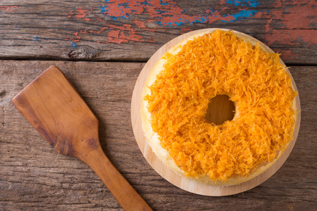 Gold Egg Yolk Thread Cakes, Thai call 'Cake Foi Tong" home made wooden backgroundの写真素材