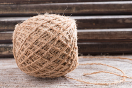 Hemp rope on wooden background