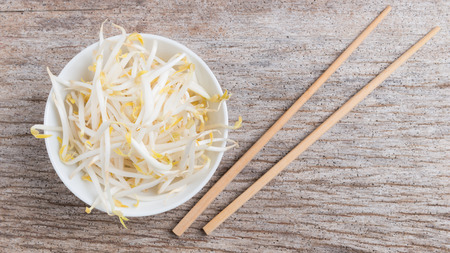 Bean sprouts on wooden backgroundの写真素材