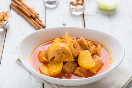 Massaman pork curry on wood background. Thai coconut milk curry.の写真素材